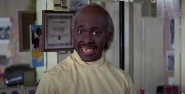 Clarence (played by Eddie Murphy) in the barbershop, a memorable character in Coming to America.