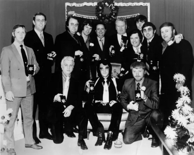 Elvis Presley (center) is seen alongside Dr. Nichopoulos to his right. (Photo: Getty)