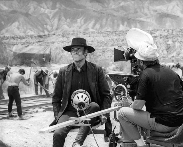 Leone watches attentively as Jason Robards is slated for a take, ensuring every shot meets his exacting vision. (Photo courtesy of Reel Art Press.)