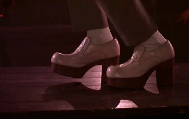 Pee-Wee’s white patent loafers, which were highlighted in the dance scene, were not only a humorous touch but also a bold fashion statement.