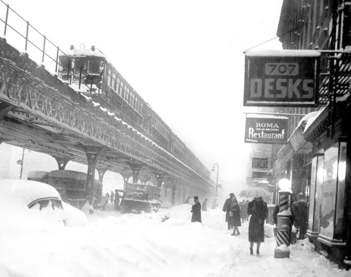 Third Avenue’s elevated train grinds to a frozen halt, abandoned amidst snow, wind, and ice, 1947.