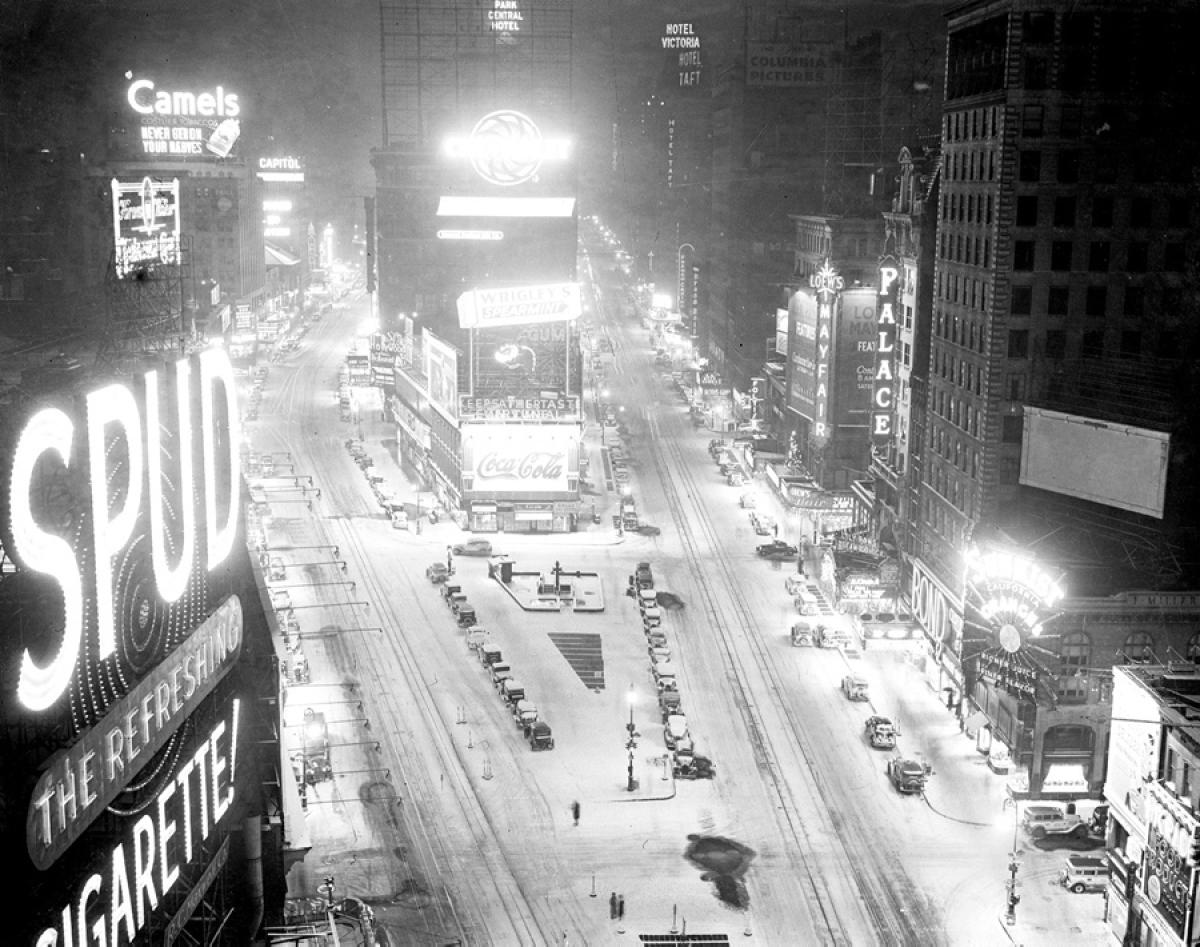 Times Square’s usual neon brilliance fades beneath a thick blanket of snow after a powerful winter storm, 1935.