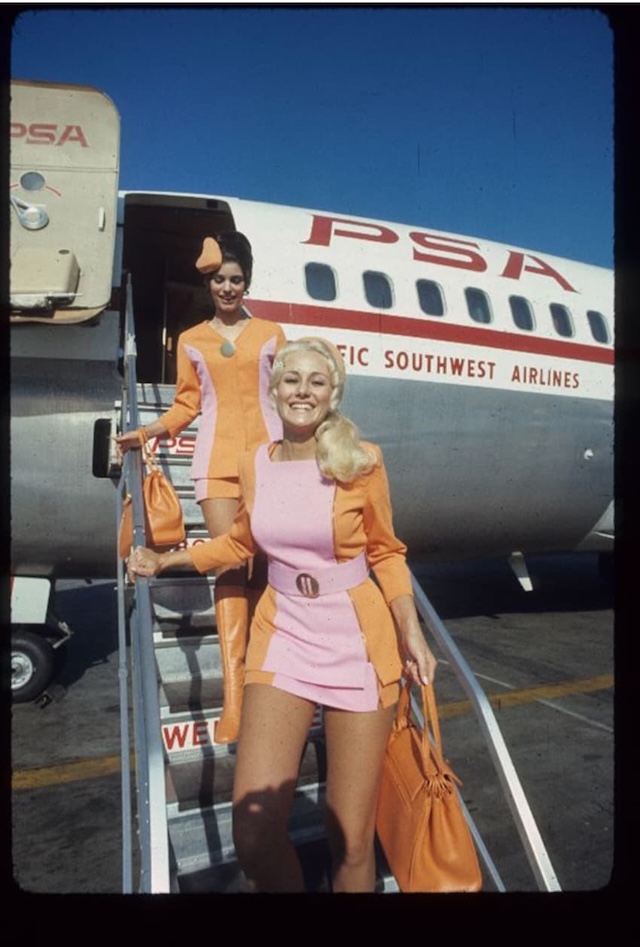 Southwest stewardesses smile while deboarding a plane