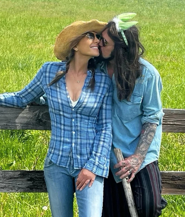 Elizabeth Hurley and Billy Ray Cyrus posted a cozy photo on Instagram, embracing in the serene countryside with the caption “Happy Easter,”
