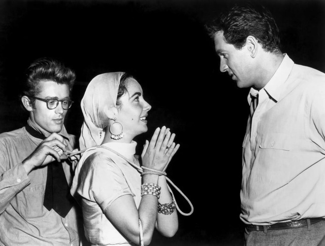 James Dean, Elizabeth Taylor, and Rock Hudson captured in a rare moment on the set of Giant—the film that would forever bond them.
