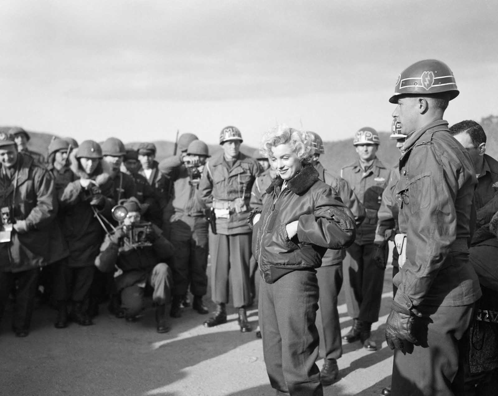 Marilyn Monroe warmly greeted the troops, her smile lighting up the room.