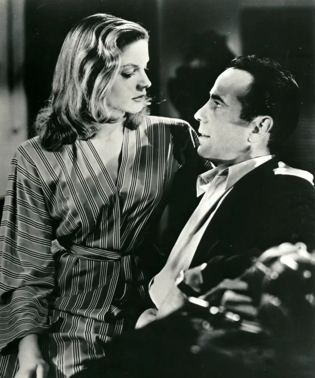 A powerful close-up from one of Bacall’s film noir roles, embodying the sultry femme fatale persona she famously portrayed.