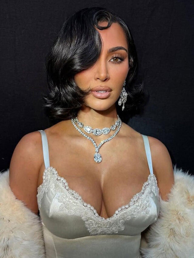 Draped in opulence and old-Hollywood charm, Kim owns the room with her magnetic aura and flawless look.
