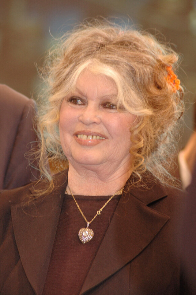 A graceful appearance—her smile still radiant, reflecting decades of resilience and passion.