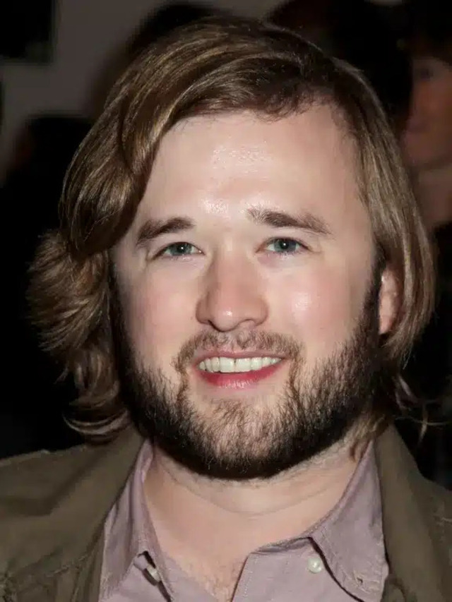 With longer hair and a beard, Haley embraces a grounded, character-actor image in his later career.