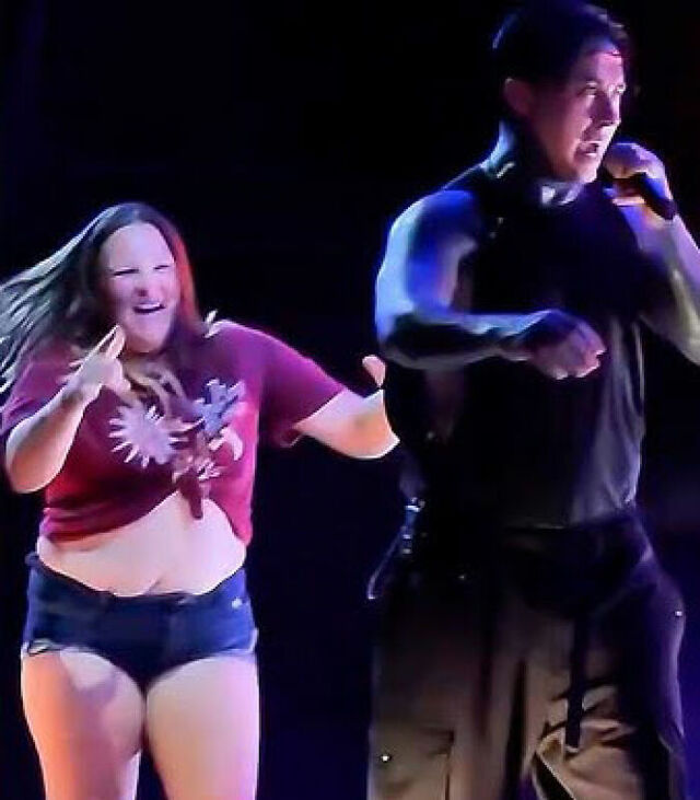 A woman, bypassing security, rushed the stage, intent on getting close to her idols.