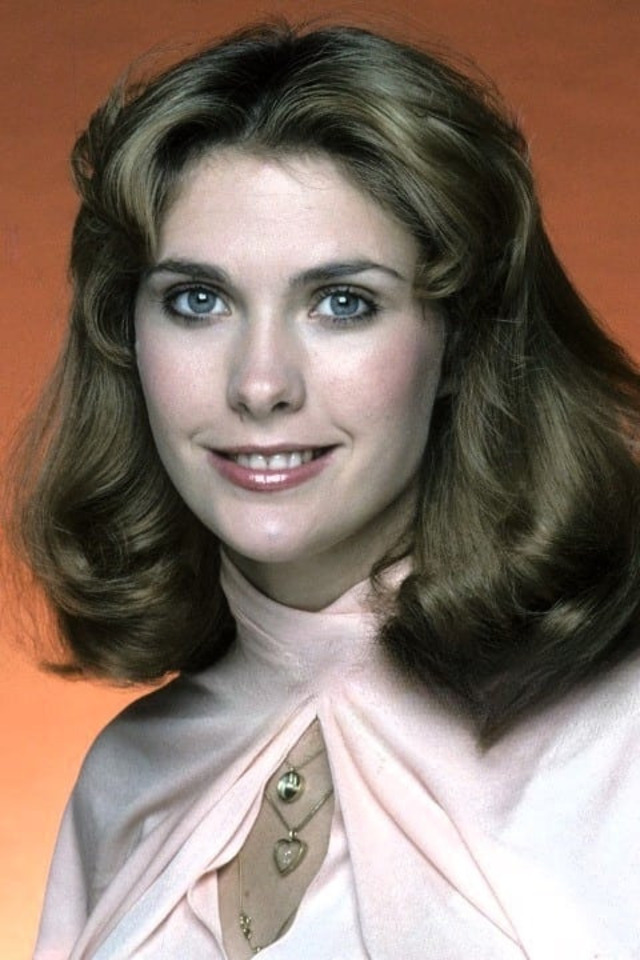 Colleen Camp in a serene portrait, with her signature glamorous hairstyle and sparkling eyes, a true reflection of her timeless elegance.