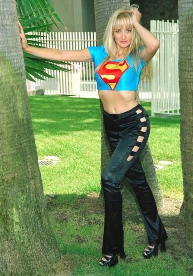 Elegance meets fun: Monique Noel embraces her role as a fashion and beauty icon in this chic pose.