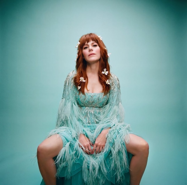 Jenny Lewis channels ethereal vibes in her sparkling, feathered dress—proving she’s always ahead of the fashion curve.