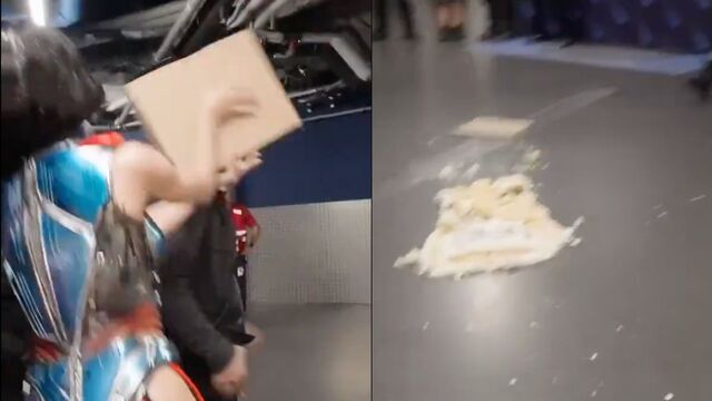 Katy, after blowing out the candles, picked up the cake and attempted to throw it at one of her staff members.