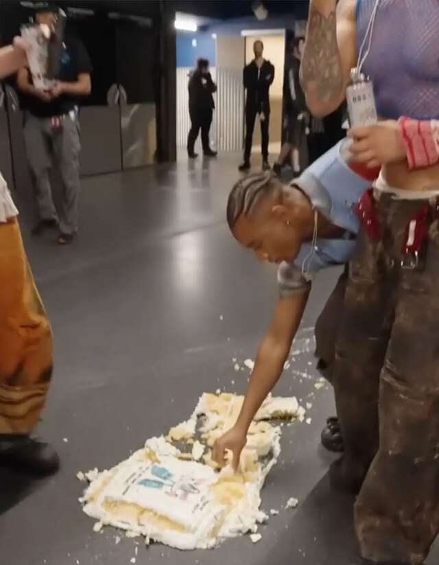The video captured backup dancers eating the cake off the floor, which only amplified the negative reactions