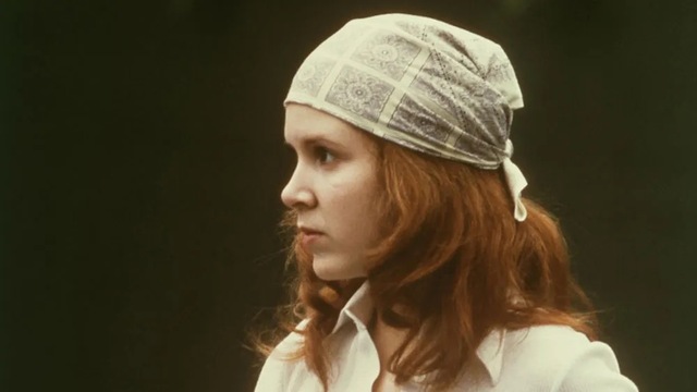 Carrie Fisher in A New Hope, looking fierce as Princess Leia.