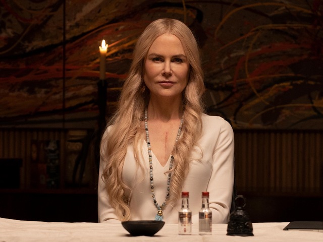 The actress rejects traditional gowns in favor of a tailored black pantsuit, a symbolic move toward modern power-dressing.