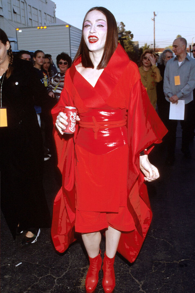 Madonna (1999) defined her Ray of Light era with a striking red Jean Paul Gaultier kimono-style ensemble.
