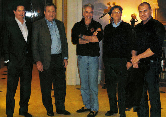 A rare captured moment showing Bill Gates (second from right) in the company of Jeffrey Epstein (center).